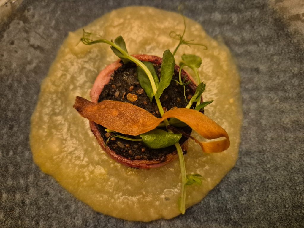 Ten item tasting menu item.. black pudding and apple sauce
